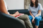 psychotherapy-session-woman-talking-to-his-psychologist-in-the-studio-stockpack-gettyimages-scaled-jpg